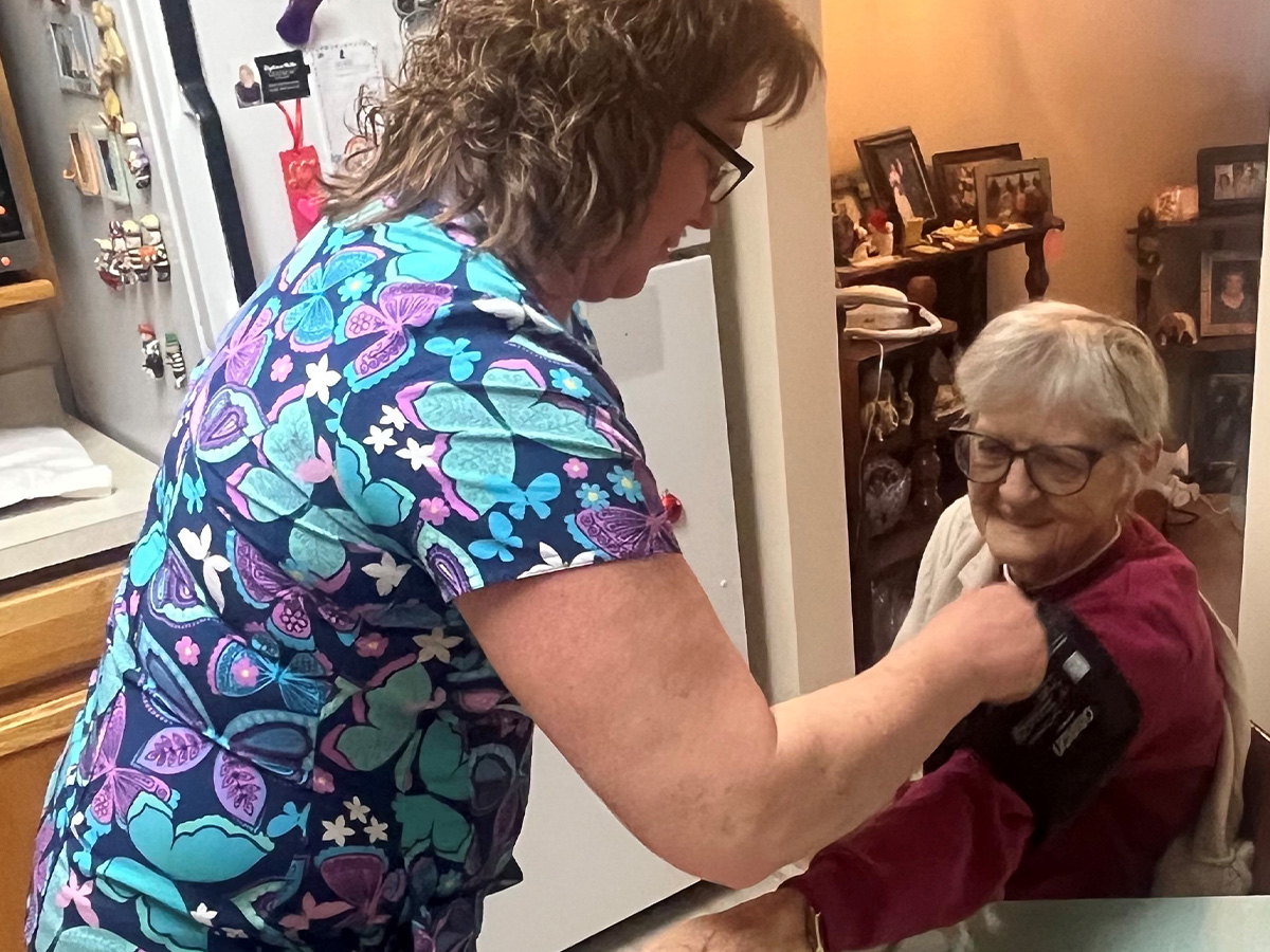 elderly lady getting blood pressure