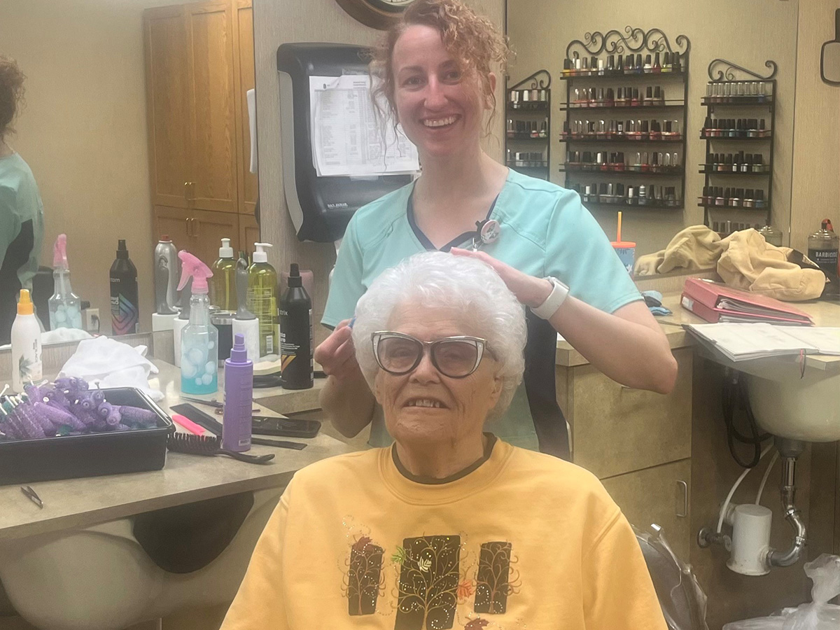 elderly lady getting her hair done in salon