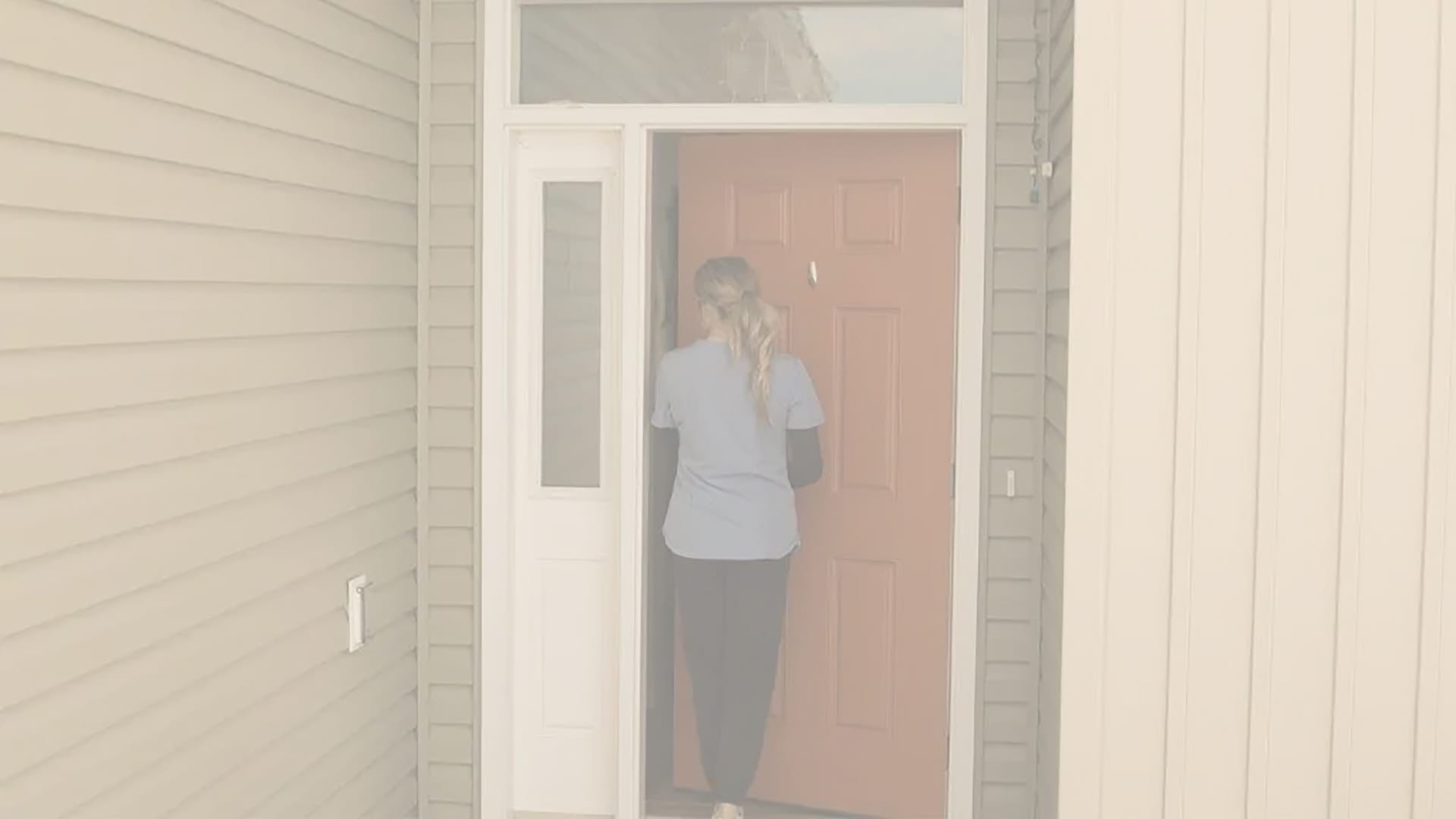 Nurse going inside home